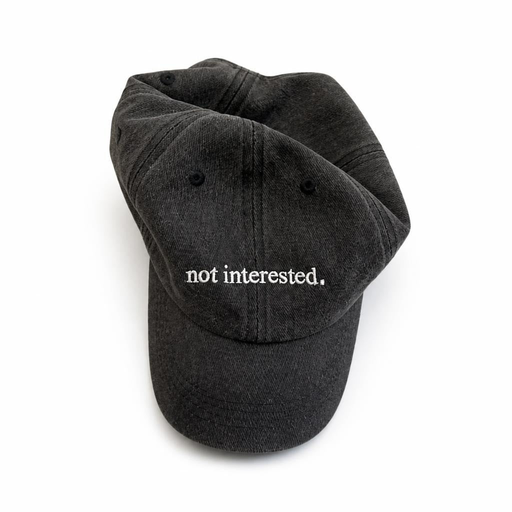 Black Dad Cap Embroidered 'not Interested' - pre-loved at Why Go Less, Lebanon