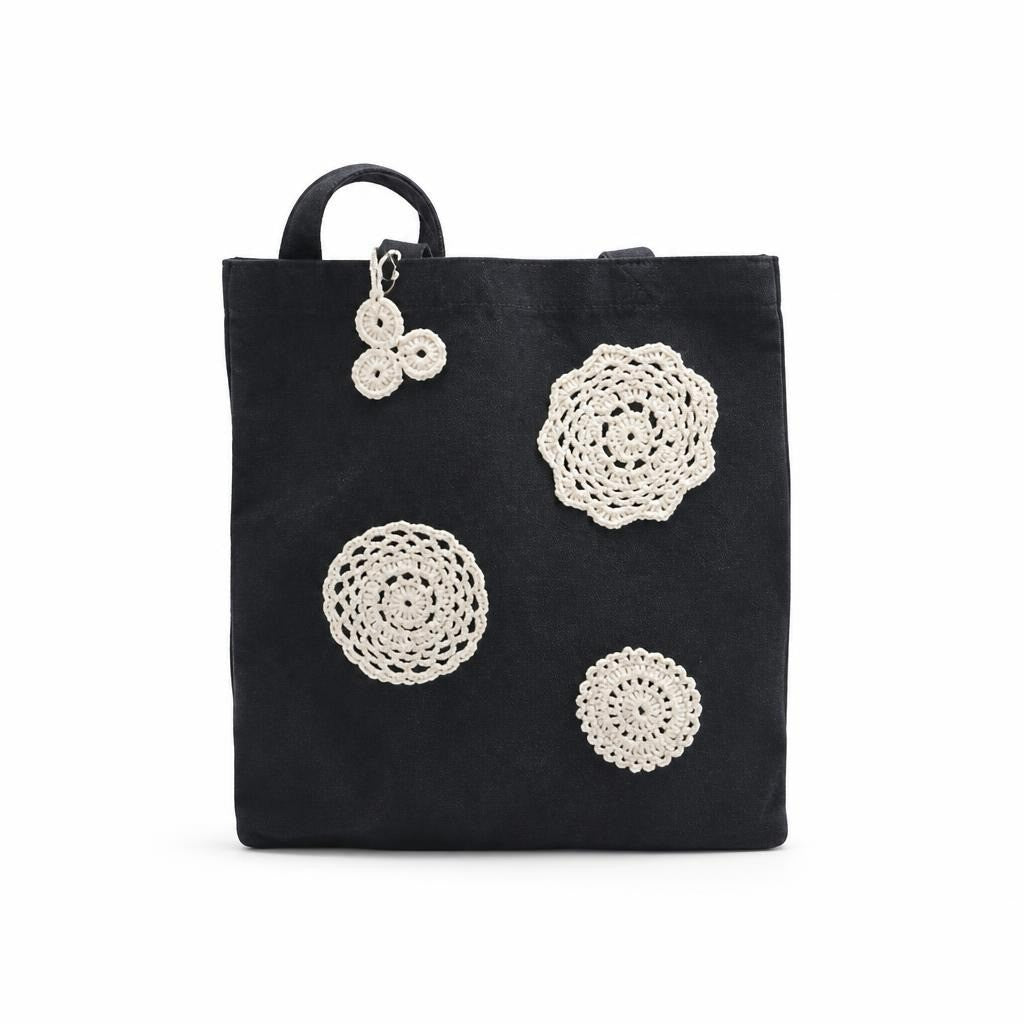 Black tote bag with white crochet doily appliques - white studio shot, second-hand at Why Go Less, Dekwaneh, Lebanon