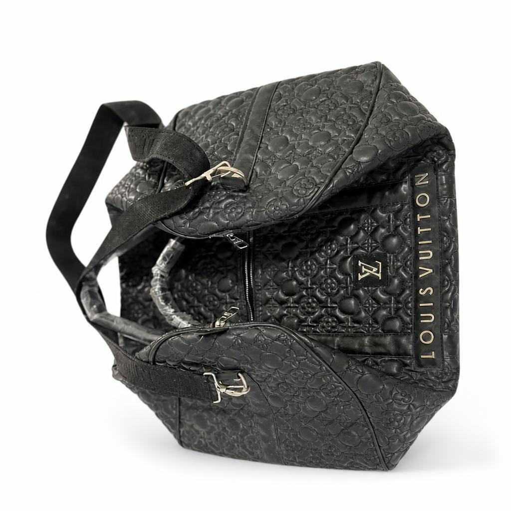 Louis Vuitton monogram embossed black duffle bag - white studio shot, second-hand at Why Go Less, Dekwaneh, Lebanon