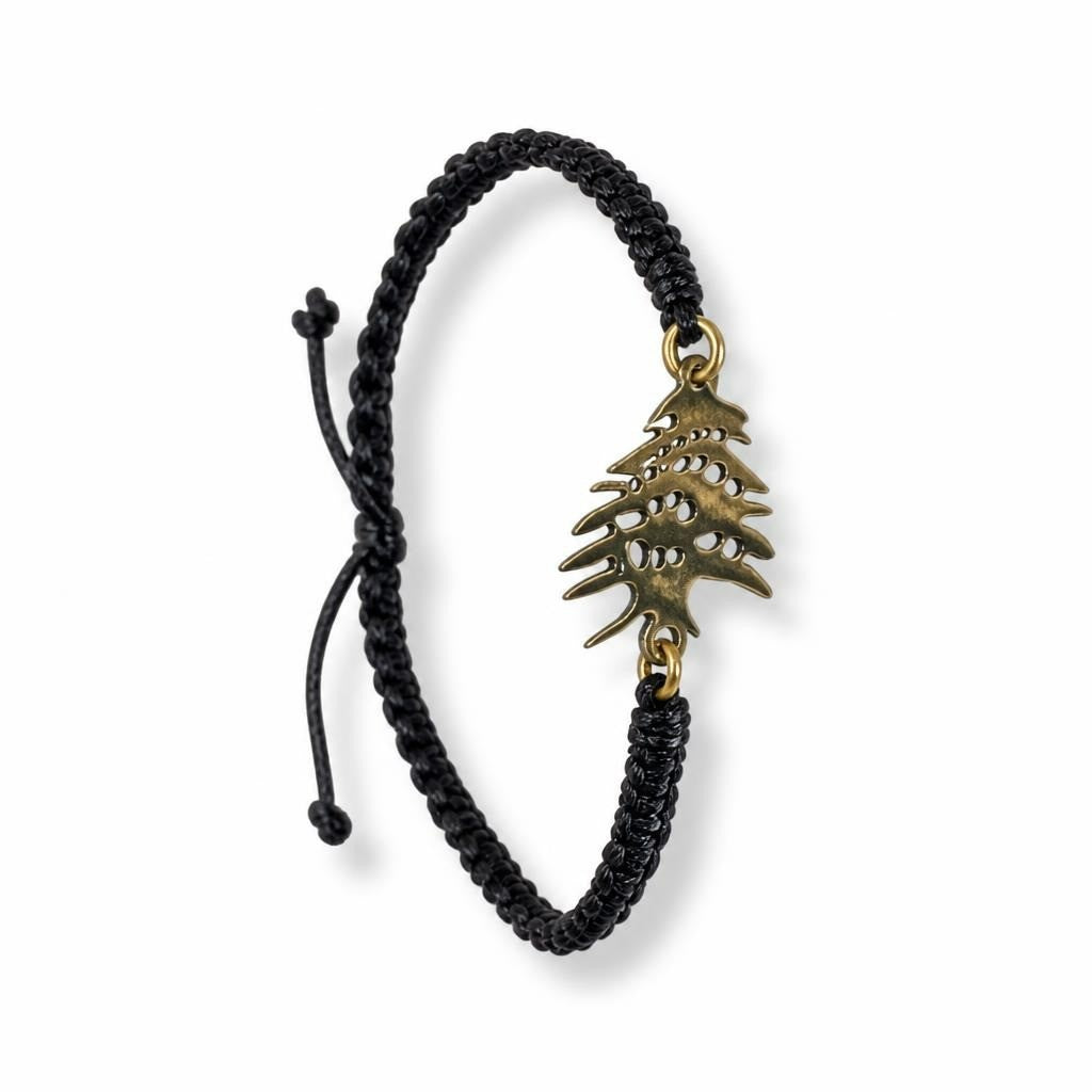Black macrame bracelet gold cedar of Lebanon charm - white studio shot, second-hand at Why Go Less, Dekwaneh, Lebanon
