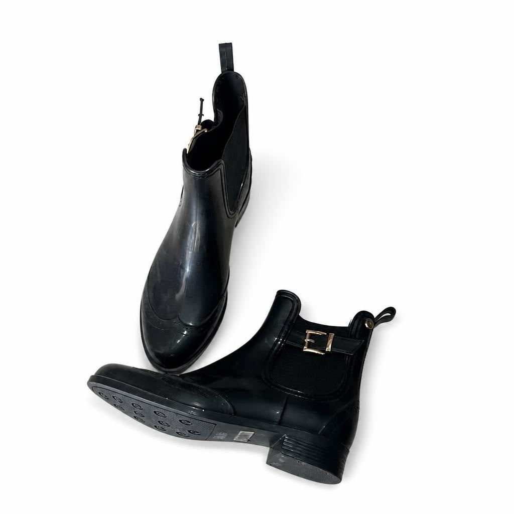 Black Glossy Chelsea Rain Boots w/ Gold Buckle - white studio shot, second-hand at Why Go Less, Dekwaneh, Lebanon