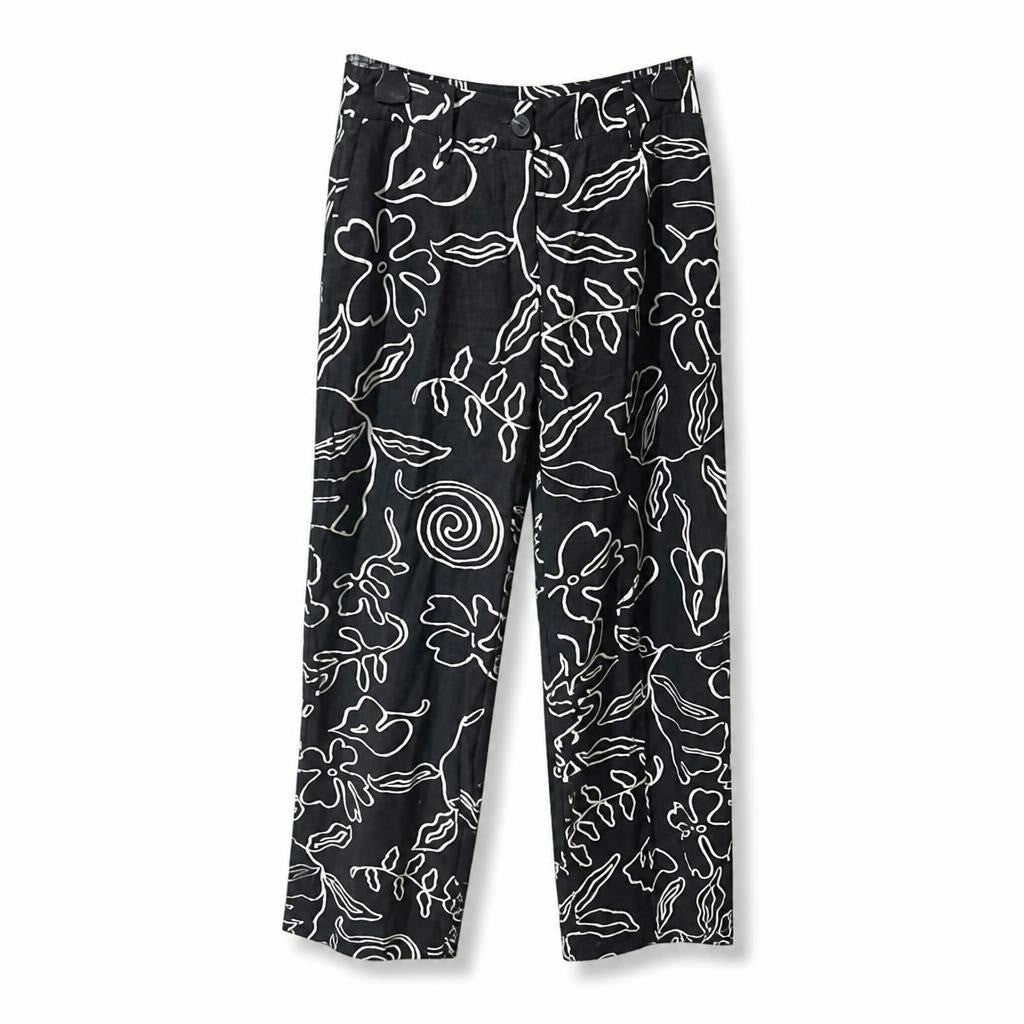 Black floral print wide-leg trousers, B&W - white studio shot, second-hand at Why Go Less, Dekwaneh, Lebanon