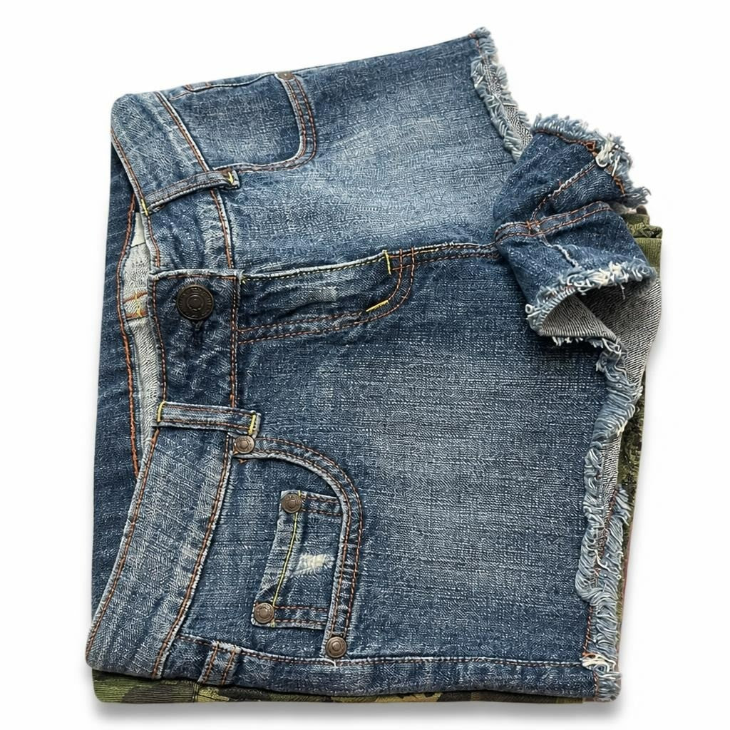 Medium wash raw hem distressed denim shorts - white studio shot, second-hand at Why Go Less, Dekwaneh, Lebanon