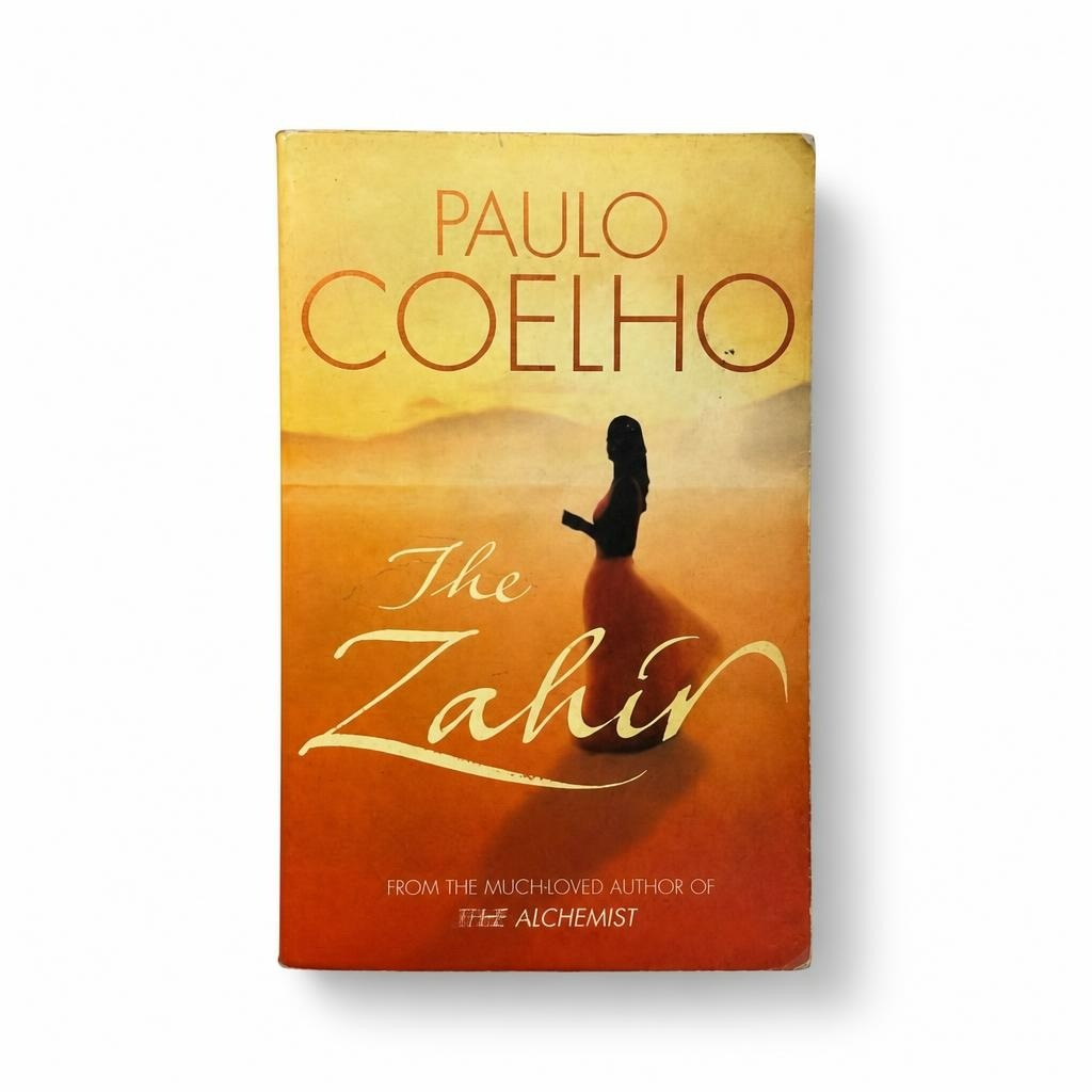 The Zahir by Paulo Coelho English paperback - white studio shot, second-hand at Why Go Less, Dekwaneh, Lebanon