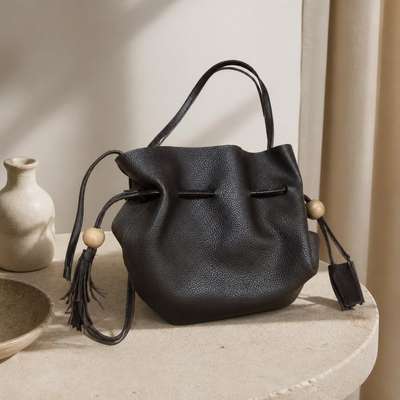 Dark Brown Pebbled Drawstring Bucket Bag With Tassels - lifestyle shot, second-hand at Why Go Less, Dekwaneh, Lebanon