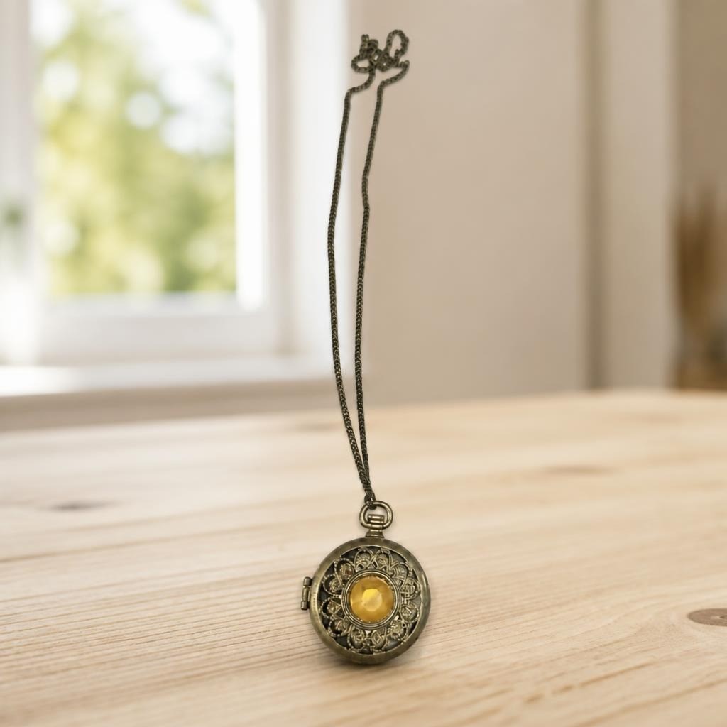 Antique-style Pocket Watch Pendant Necklace, Bronze Vintage Gold-tone Locket Pendant Necklace, Filigree - on surface shot, second-hand at Why Go Less, Dekwaneh, Lebanon