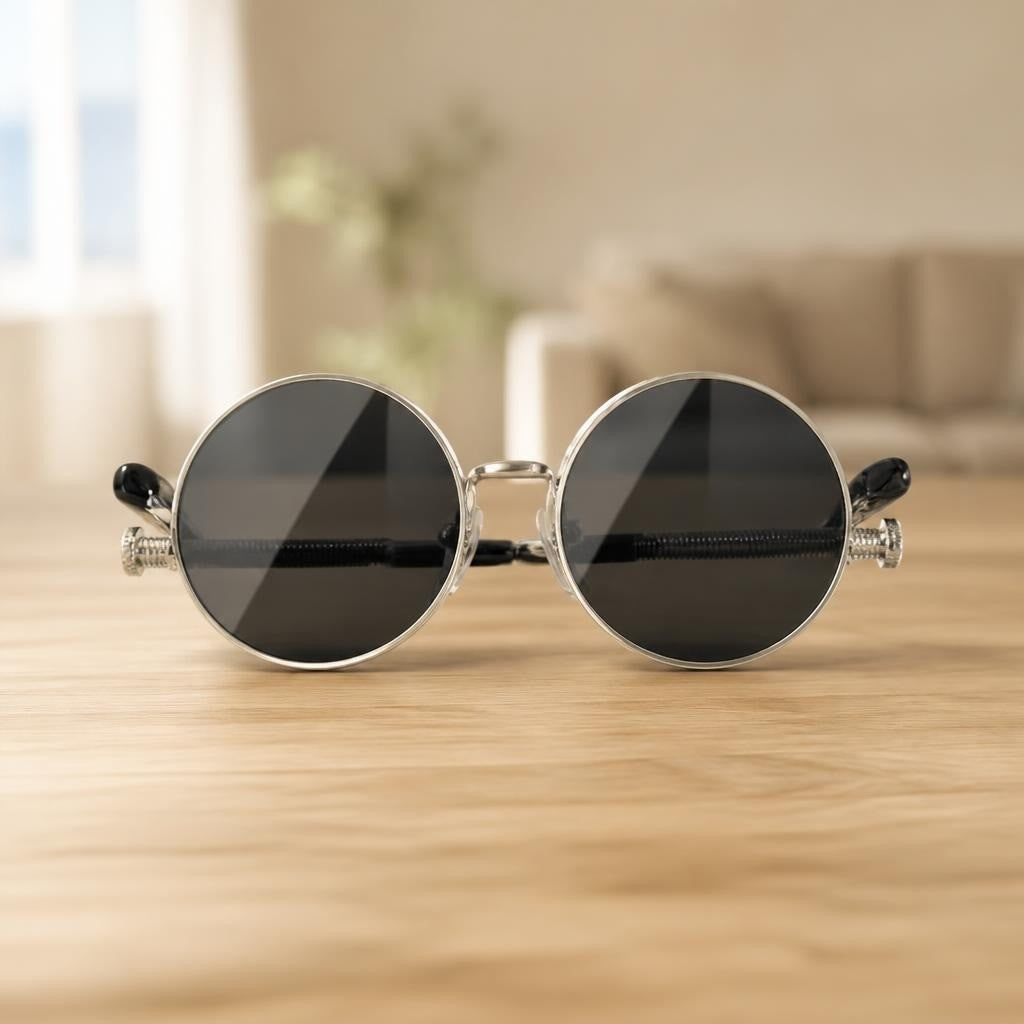 Round retro silver metal frame dark lens sunglasses - on surface shot, second-hand at Why Go Less, Dekwaneh, Lebanon