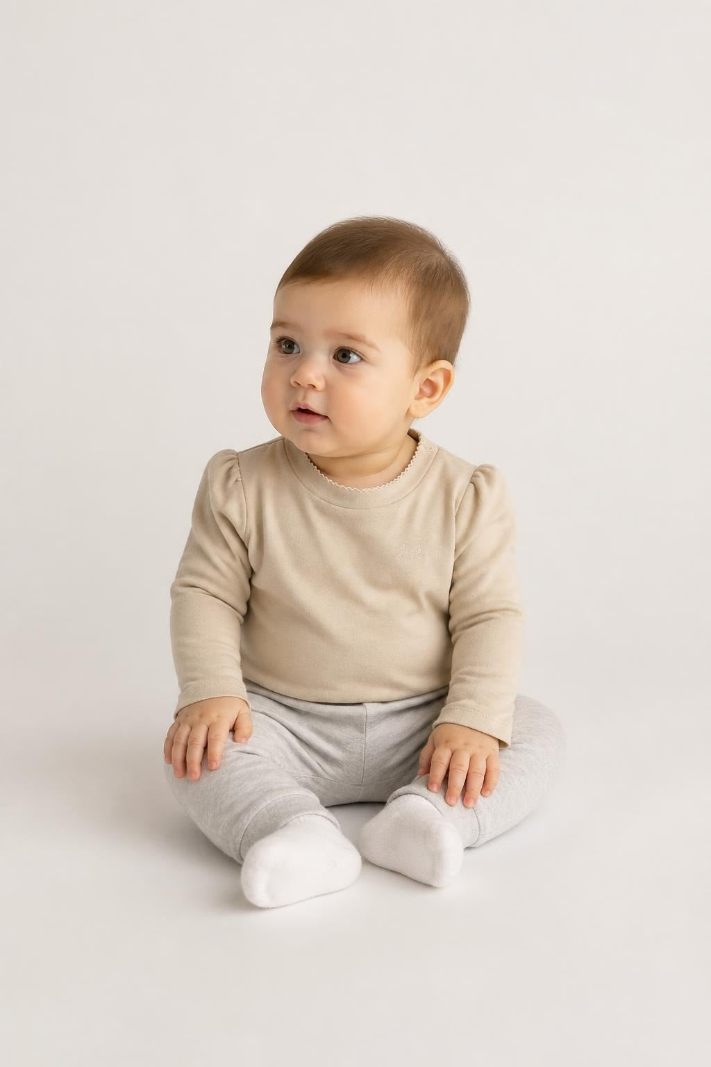 Beige Long-Sleeve Baby Top With Love Me Embroidery - on model shot, second-hand at Why Go Less, Dekwaneh, Lebanon